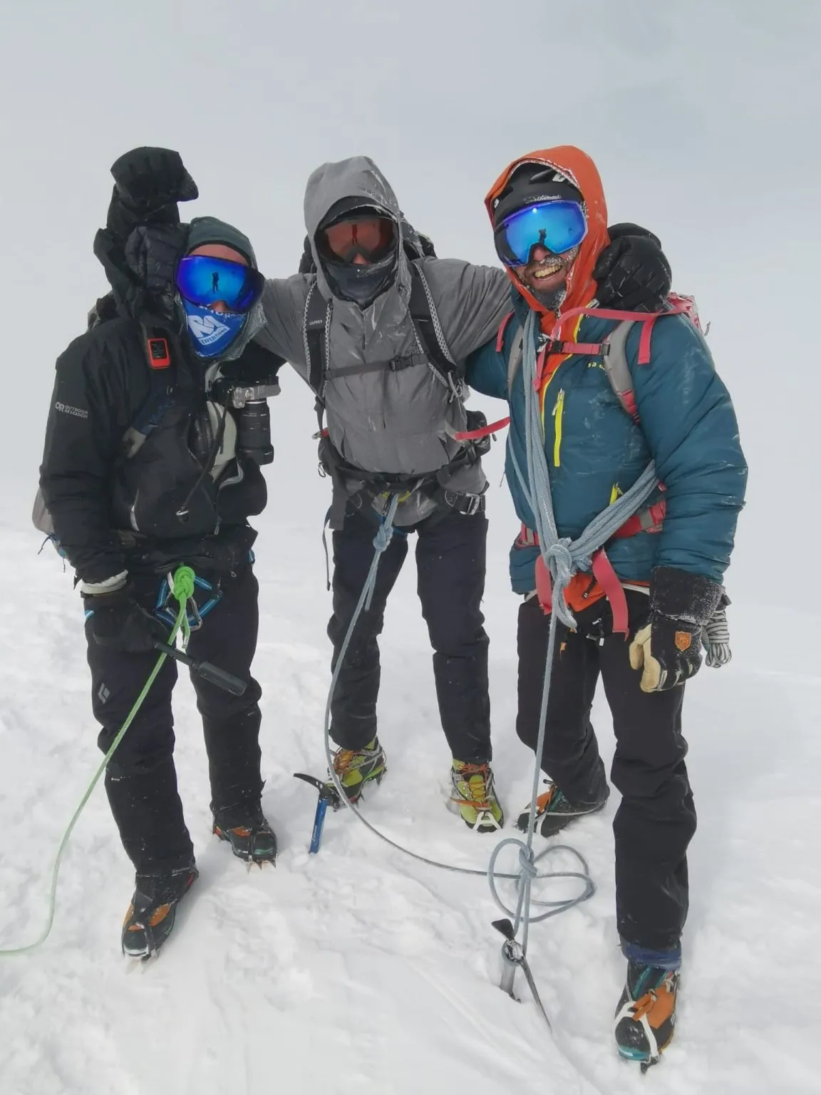 Dave with his climbing partner and guide on the summit of Mont Blanc in a snowstorm